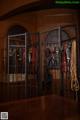 A display of horse bridles and reins in a room.